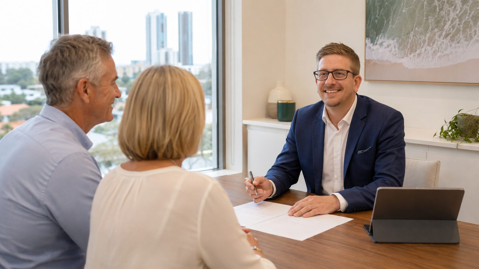 Dave Lang discussing retirement planning with a Gold Coast couple